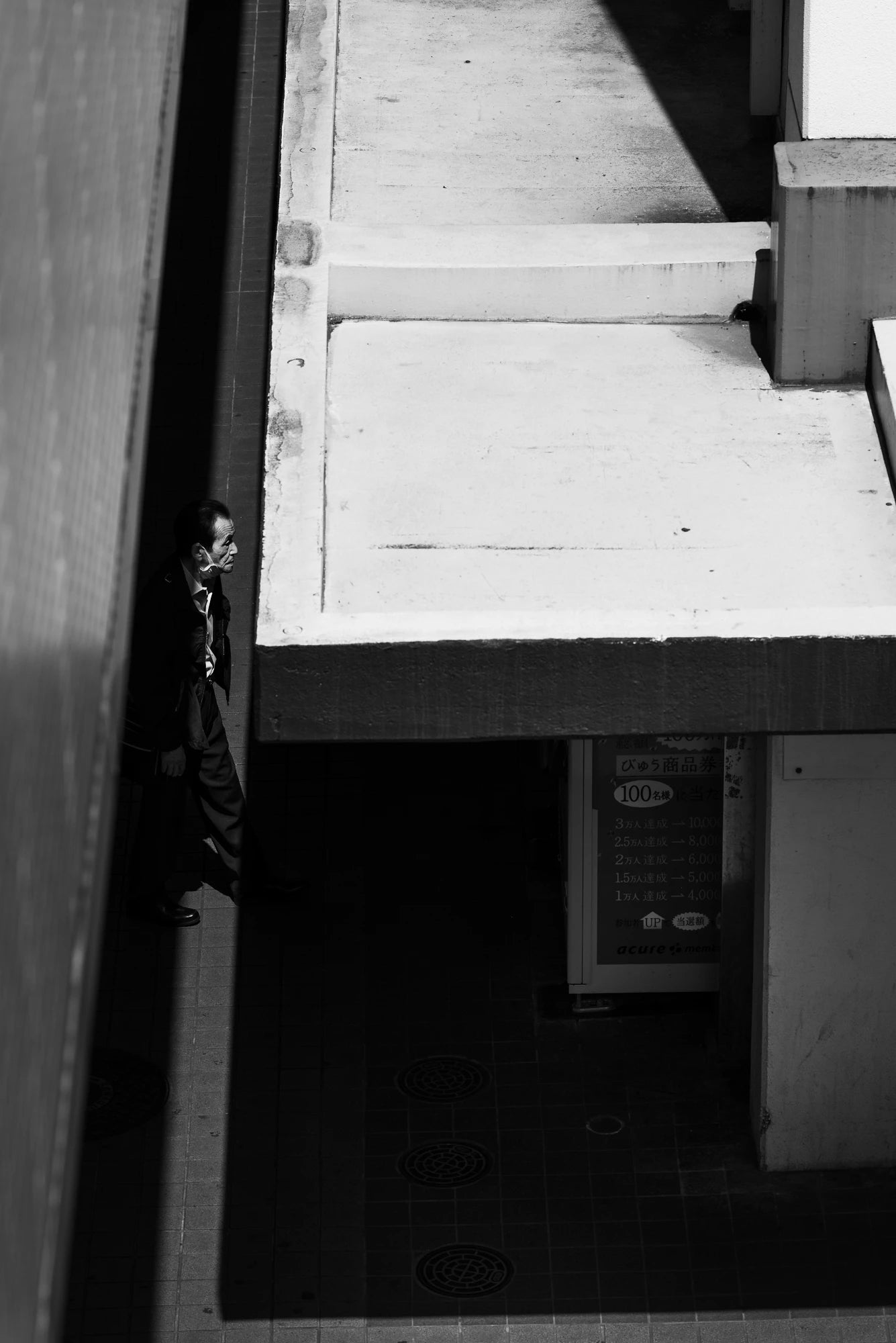 Japanese salaryman in high-contrast street photography